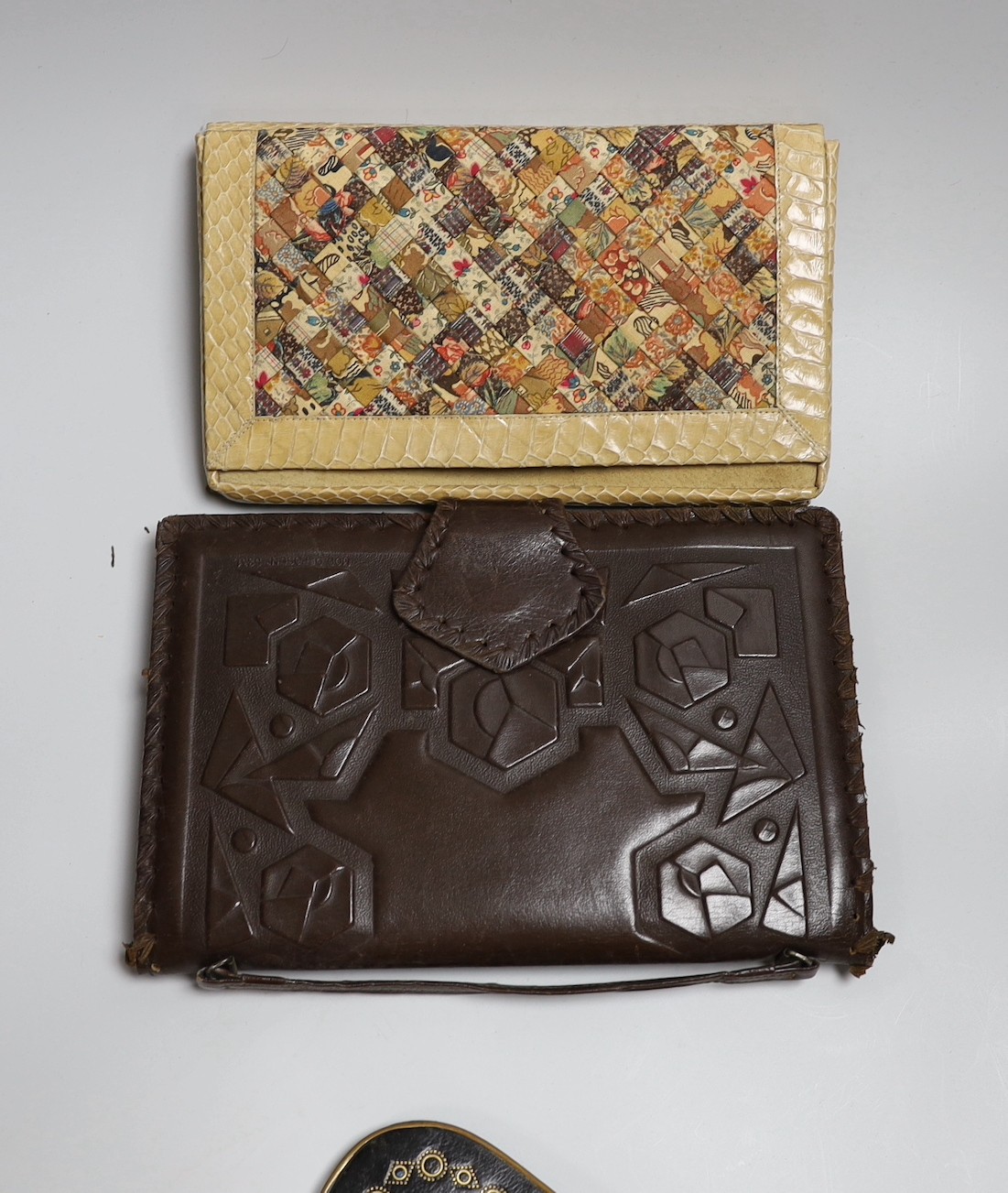 A small collection of unusual stained leather and a patchwork fabric and snake skin clutch bag (6)